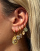 Miz Casa & Co Ruby Huggie Earrings Gold Clear